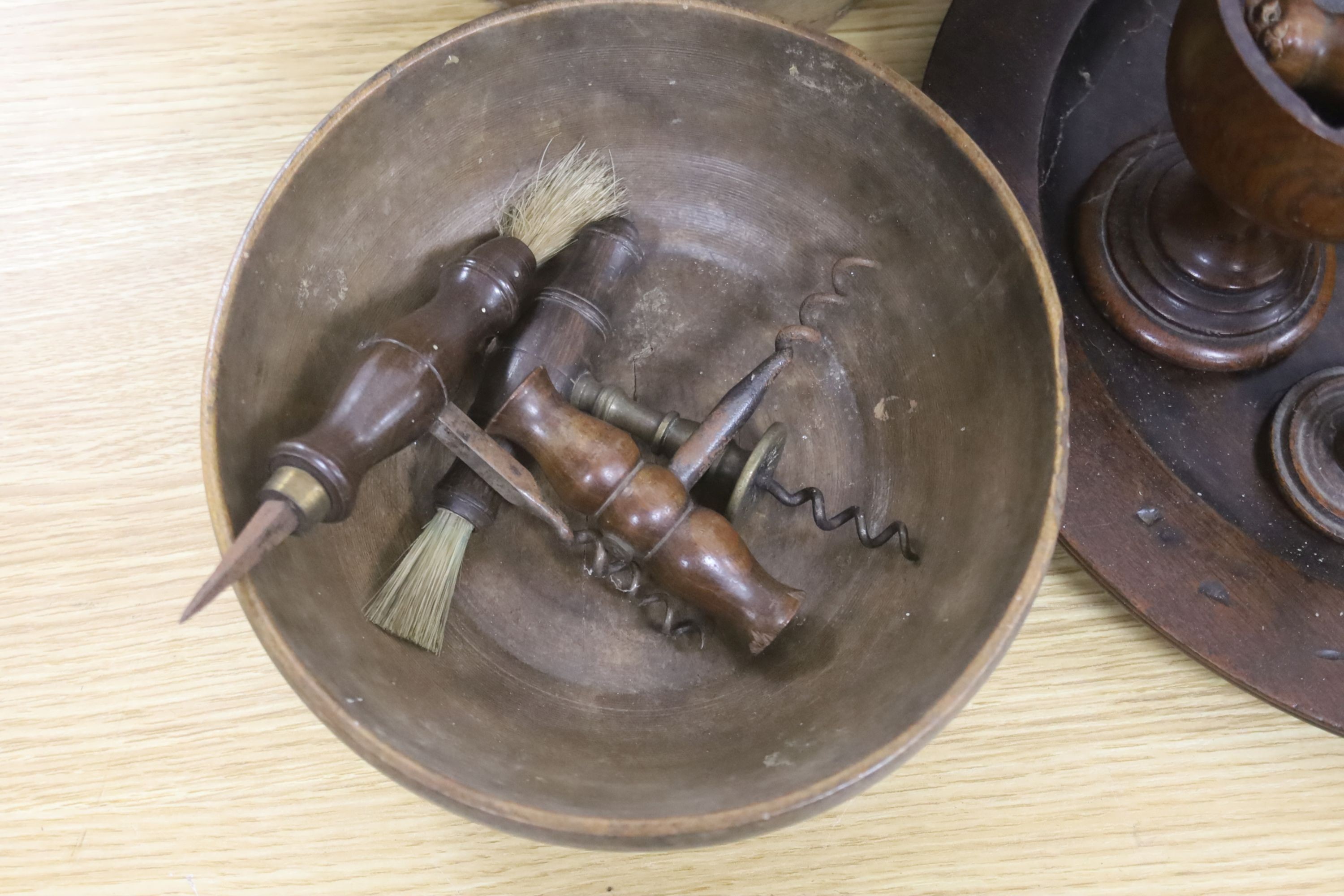 A group of assorted treen including an 18th century sliding lid mahogany box, a candle stand and various goblets etc.